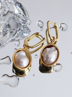 Elevate your ensemble with our Oval Drop Baroque Shaped Pearl Earrings, the perfect complement to the exquisite necklace in our collection. Meticulously crafted to embody the same timeless elegance, these earrings are designed to enhance your style with sophistication. Metal: 18K Recycled Gold Plated On Brass Pearl: Natural Baroque Shaped Pearl Earring Length: 45mm Gold And Pearls, Ornate Jewelry, Edison Pearls, Pearl Earring, Tiger Eye Stone, Recycled Gold, Matching Necklaces, Baroque Pearls, Ring Bracelet