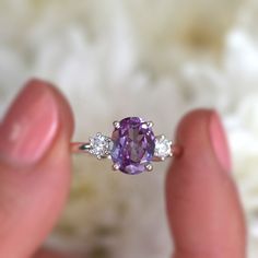 With a brilliant cut like that, this ring is nothing but pure brilliance in itself. With a lovely Amethyst, the Khloe ring with two side moissanites, sparkles like there is no tomorrow. Celebrate your milestones or special occasions with this ring as the perfect gift for sisters as a best friend's gift, or just as an everyday celebration of life in general. Details: Center stone Gemstone: Amethyst Stone Shape: Oval Measurements: approx. 9x7mm Side stones Gemstone: Moissanite Shape: Round Measure Oval Amethyst Ring, There Is No Tomorrow, Purple Stone Rings, No Tomorrow, Amethyst Ring Engagement, Cute Engagement Rings, Purple Amethyst Ring, Amethyst And Diamond Ring, Rose Quartz Ring