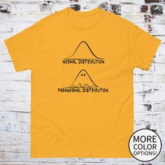 a yellow t - shirt with the words normal distribution and an image of a mountain