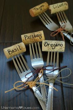 there are forks and spoons with cork saying basili parsley or oregano on them