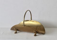 a gold purse sitting on top of a white table