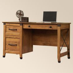 a wooden desk with two drawers and a laptop computer on it's top shelf