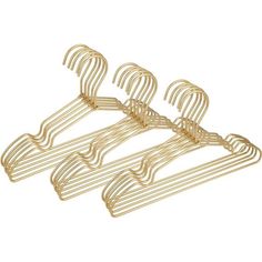 three gold metal clothes hangers on a white background