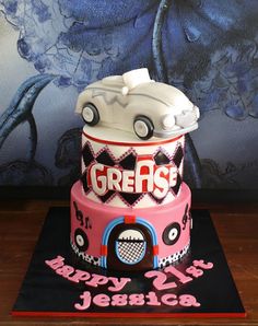 a birthday cake with a car on top