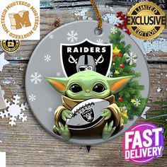 a christmas ornament with an image of the baby yoda holding a football