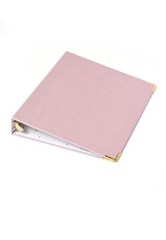 a pink binder with two gold rings on it's end and a white background