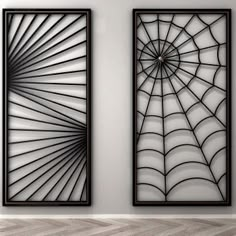 two metal art pieces hanging on the wall