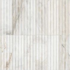 a white marble tile floor with vertical lines