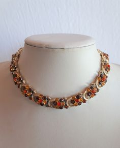 Vintage 50's gold color metal rhodium plate with yellow orange topaz paste rhinestone flower with leaf panel link adjustable choker necklace.  17.5 inches including the extender; 0.5 inches N to S. good condition with 2 rhinestones missing -sold as is Thank you for watching our other items! Similar items are listed Combined shipping available where possible -please contact us for details before buying the items. Jaune Orange, Rhinestone Flower, Yellow Orange, Rhodium Plated, Favorite Jewelry, Necklace Etsy, Topaz, Gold Color, Choker Necklace