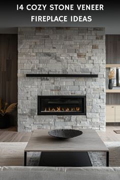 Cozy living room with a modern stone veneer fireplace, black insert, and decorative bowl on coffee table. Linear Fireplace Ideas Stone, Paint Around Fireplace, Veneer Fireplace, Simulator Room, Stone Veneer Fireplace, Fireplace Accent Walls, Golf Simulator Room, Ranch House Remodel, Electric Logs