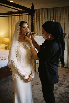 the bride is getting ready for her big day to be finished with makeup and make - up