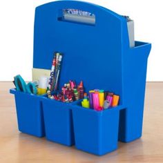 a blue desk caddy filled with school supplies