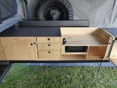 a camper trailer with an entertainment center built into it