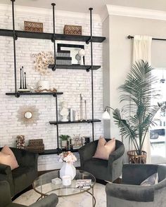 the living room is clean and ready for guests to come home with their belongings on the shelves