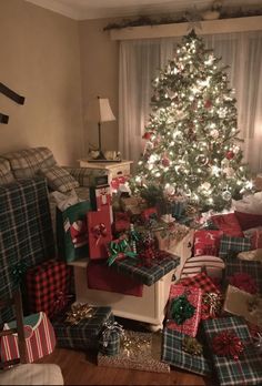 a christmas tree with presents under it