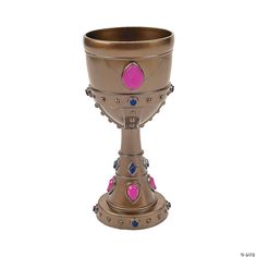 a large metal cup with pink and blue decorations on the rim, sitting in front of a white background