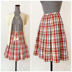 "1960s Miss Pat pleated skirt. Light red, blue, gold and white plaid pattern. High waisted with dropped pleats and a wide A line cut. Side zipper and button closure. In great vintage condition with a couple tiny specks - please see photos. All measurements are taken with the garment laying flat and doubled for the bust, waist, and hips. Waist: 22\" Hips: open Length: 22\" Label: Miss Pat Material: Not listed; looks / feels like cotton or cotton blend Size on Tag: N/A Approx. Fit: XXS Some garmen Retro Pleated Mini Skirt, Retro Pleated Skirt For Daywear, Retro Full Pleated Skirt For Summer, Retro Summer Pleated Skirt, Retro Plaid Lined Skirt, Vintage Fitted Accordion Pleated Skirt, Retro Fitted Cotton Pleated Skirt, Vintage Pleated Cotton Skirt, Vintage Cotton Pleated Skirt