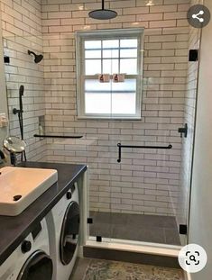 a washer and dryer in a small bathroom with white brick walls, black counter tops