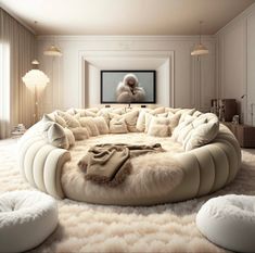 a living room filled with lots of white furniture and pillows on top of a rug