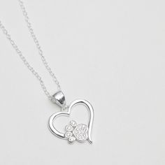 Fastening: Lobster Clasp Fastening   Chain length: 16"   Extender length: 2"   Dimensions: 10mm   Sterling Silver Jewellery   Material: Sterling Silver 925    Our iconic Simply Silver collection boasts fine, contemporary and meaningful 925 Sterling Silver jewellery. This beautifully designed Simply Silver Sterling Silver 925 Paw Print And Heart Pendant Necklace is the perfect way to finish any outfit, whatever the occasion. Heart Shaped Jewelry, Silver Collection, Sterling Silver Jewellery, Matching Jewelry, Bridal Bracelet, Earring Sale, Bride Jewellery, Bridal Necklace, Bridesmaid Jewelry