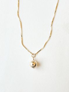 Now our Patsy disco chain comes as a pendant necklace! The original party on a chain. This 5mm or 8mm 14k gold disco ball on a sparkly solid gold box chain is perfect for anyone who loves to party, has an eclectic style, or likes to add some character to their jewelry. It is available in yellow or white gold. The 5mm ball comes on a 0.5mm box chain and the 8mm ball comes with a 0.75mm wide chain. Please indicate in the MESSAGE SELLER field at check out if you would like white gold or yellow gold. DETAILS: .:5mm or 8mm 14k gold disco ball charm on sparkly solid gold box chain. .:Available in yellow or white gold. .:Comes in a jewelry pouch within a cushioned Kraft jewelry box. .:Available in 16, 18, and 20 inch lengths. Please choose your length and disco ball size in the drop down menu bel Mirrorball Jewelry, Gold Minimalist Charm Necklace For Party, Yellow Gold Pendant Charm Necklace For Party, Minimalist Gold Charm Necklace For Party, Party Yellow Gold Pendant Charm Necklace, Party Yellow Gold Pendant Charm Necklaces, Dainty 14k Gold Necklace For Party, Dainty 14k Gold Necklaces For Party, Party Yellow Gold Charm Necklace With Adjustable Chain