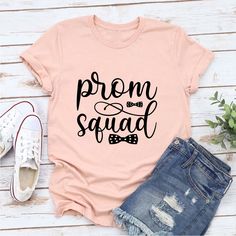 "Step into the spotlight with the stylish \"Prom Squad\" tee. This shirt celebrates the camaraderie and excitement of being part of a close-knit group ready to dance the night away at the prom, making memories that will last a lifetime. Please let us know if you have any special customization ideas. Quality: We prioritize quality to ensure your utmost satisfaction. The t-shirt is made from premium, soft fabric that offers comfort throughout the day. The print is professionally done using high-quality ink, ensuring its durability and vibrant appearance. The t-shirt is designed for a relaxed fit, making it suitable for everyday wear or as a thoughtful gift. Color Charts: Refer to our color chart in the product images section to find the perfect hue for your \"Prom Squad\" tee. Please note th Customization Ideas, The Prom, Boys Graphic Tee, Prom Night, 30 And Single, School Life, Making Memories, Flower Wall, Soft Fabric