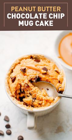 peanut butter chocolate chip mug cake in a white bowl with a spoon on the side