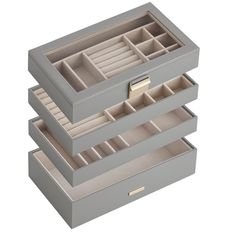 three drawers are stacked on top of each other, one with compartments and the other without