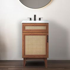 a bathroom vanity with a round mirror above it and a bamboo cabinet in the corner