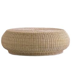 a large round wicker table on a white background with the top half covered in woven material