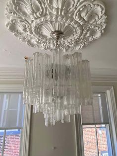 a chandelier hanging from the ceiling in a room