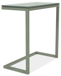 the side table is made out of metal and has a square base with a glass top