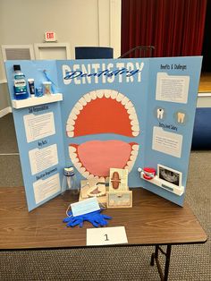 a table with a sign that says dental history on it and other items around it