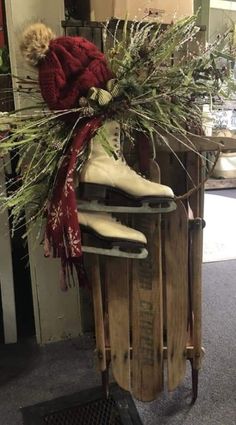 a pair of ice skates sitting on top of a wooden sled