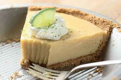 a slice of key lime pie on a plate with a fork