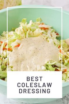 a bowl filled with coleslaw and dressing on top of a table