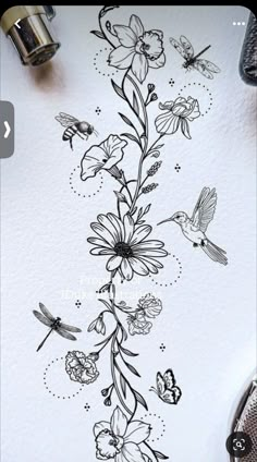 a drawing of flowers and birds on paper