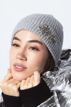 Erdem embroidered knitted hat in grey. 100% CASHMERE EMB: 60% GLASS 30% BRASS 5% POLYESTER 5% NYLON Dry Clean Made in Scotland White Winter Hat With Embroidered Logo, Embellished Beanie, Gray Hand Knitted Cap, Gray Hand-knitted Beanie Hat, Metal Choker Necklace, Gray Hand-knitted Cap, Metal Choker, Symbolic Jewelry, Scarf Headband