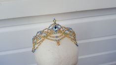 Handmade crystal ballet headpiece in your choice of colour with silver or gold. Suitable for Raymonda, Pas de Trois from Swan Lake, Aurora, Sugar Plum Fairy, any of the Sleeping Beauty Fairies, Medora, Gulnare, Pas d'Esclave, Odalisque, Gamzatti, Nikiya, Henriette, or Clemence. Made with crystal beads, acrylic pearls, and a crystal teardrop jewel.   Shipping Information: - Shipping to the United States and Canada takes approx. 12 to 28 working days. - Shipping to the United States with Express U Ballet Crowns, Ballet Tiaras, Ballet Headpieces, Sleeping Beauty Fairies, Head Dress, Sugar Plum, Swan Lake, Costume Hats, Blue Bird