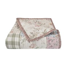 an image of a quilted blanket with flowers on it