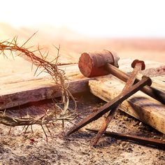 an old hammer and nails are laying on the ground