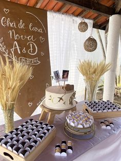 a table topped with lots of cakes and desserts