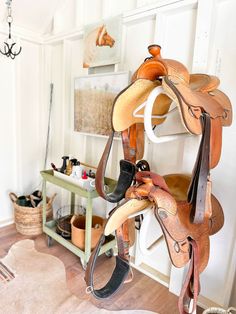 there is a horse saddle hanging on the wall