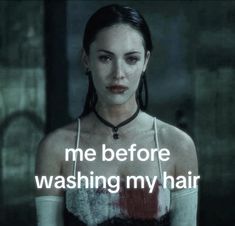 a woman with dark hair wearing a black and white top has the words me before washing my hair