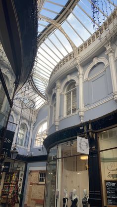 the inside of a building with glass roof