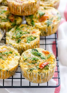 several muffins are cooling on a wire rack