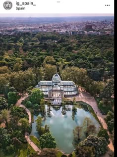 an aerial view of a large building surrounded by trees