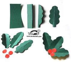 the cut out pieces of paper are ready to be made into christmas trees and holly branches