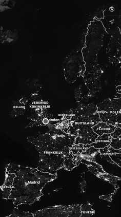 black and white photo of the city lights from space at night, taken by nasa