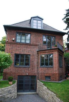 a large brick house with an attached garage